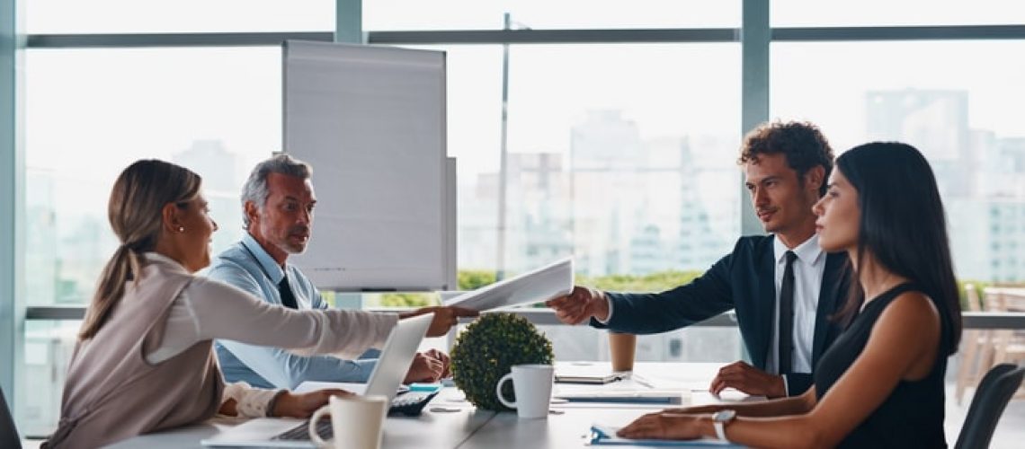 Cropped shot of corporate businesspeople having a meeting in the boardroom